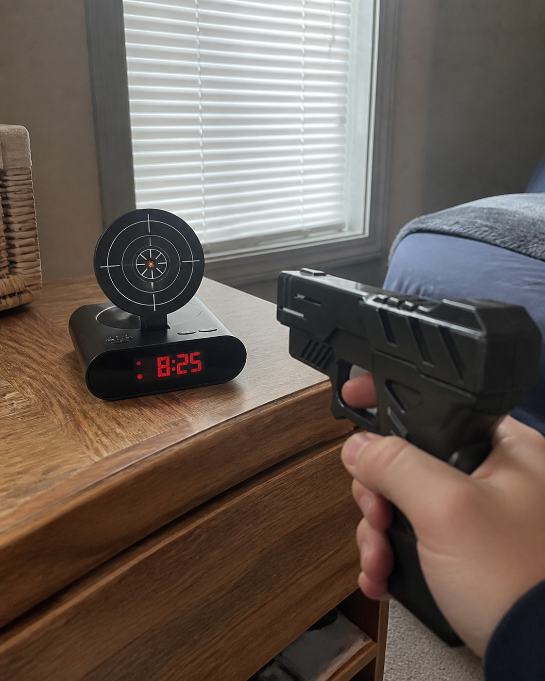 Shooting Alarm Clock on a bedside table